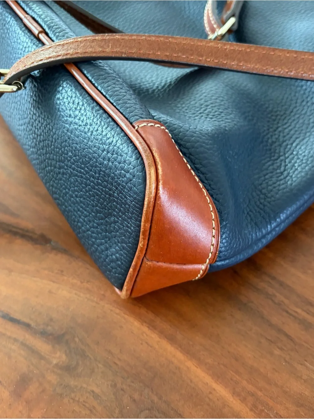 Dooney & Bourke Black Pebbled Leather Crossbody with Brown Trim & Gold Plate